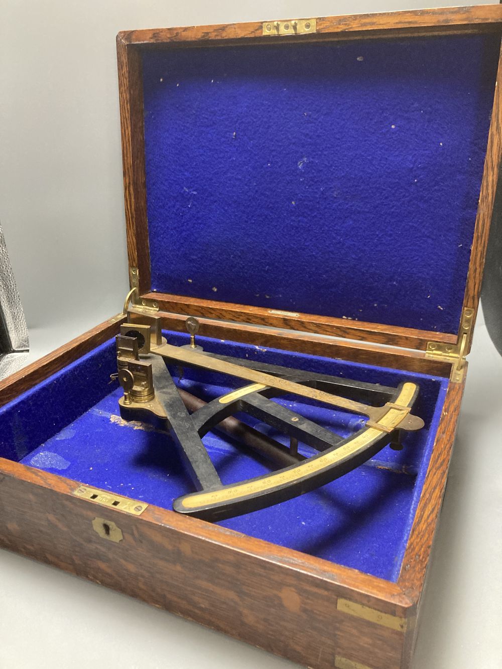 A large 19th century ebony and brass octant, scale 0-95 degrees, by Spencer & Co London, ivory scale, associated box